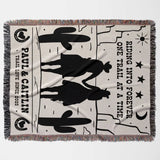 Personalized cowboy and cowgirl cotton anniversary gift woven throw blanket lat lay with cowboy design and text on a white background