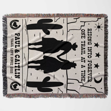 Personalized cowboy and cowgirl cotton anniversary gift woven throw blanket lat lay with cowboy design and text on a white background