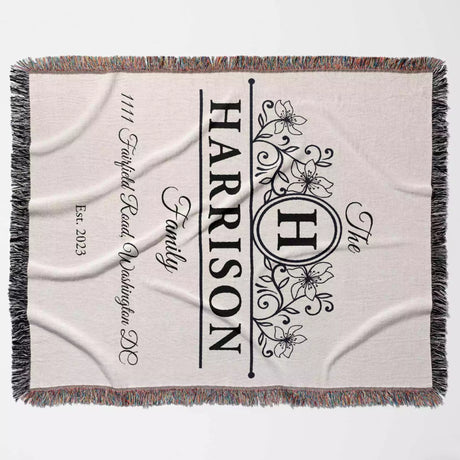 Personalized family name and address blanket with 'Harrison' and family details full view on a light background