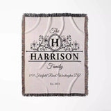 Personalized family name and address blanket with 'Harrison Family' design flat lay on a white background