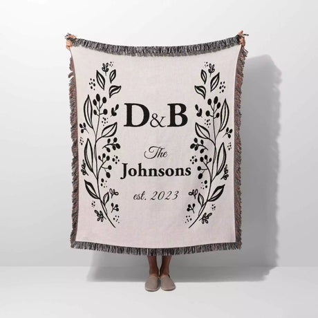 Personalized gift for couple unique cotton anniversary gift woven blanket held by a person on a white background