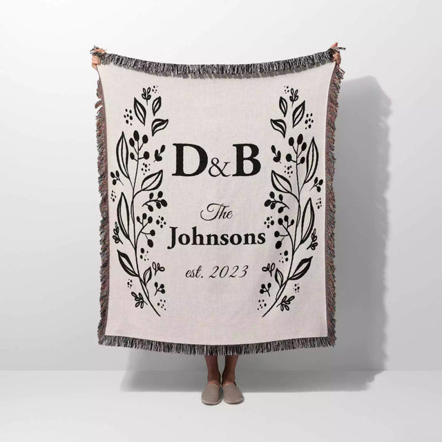 Personalized gift for couple unique cotton anniversary gift woven blanket held by a person on a white background