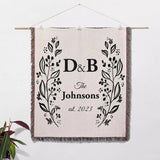 Personalized gift for couple unique cotton anniversary gift woven blanket hanging on a wall on a white background.