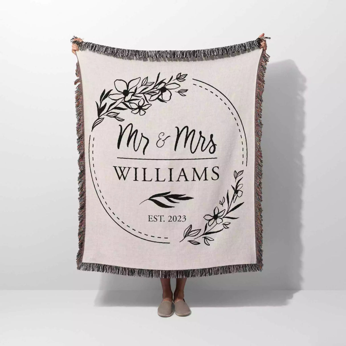 Personalized blanket with 'Mr & Mrs Williams' text and flowers on a white background