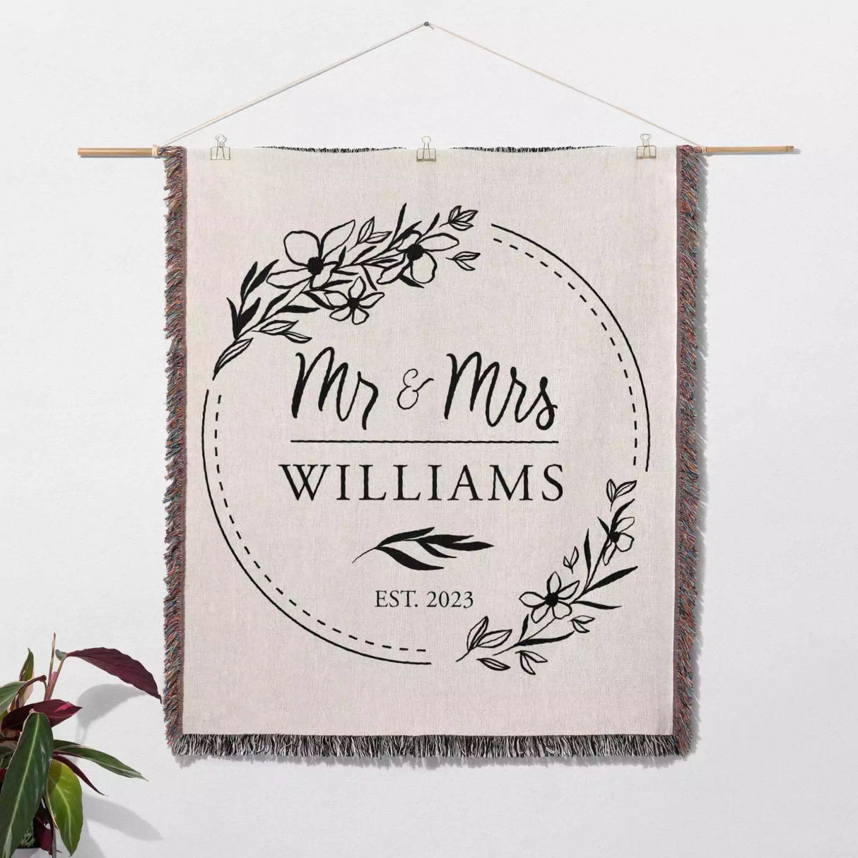 Personalized woven throw blanket wall hanging with 'Mr & Mrs Williams' text on a neutral background