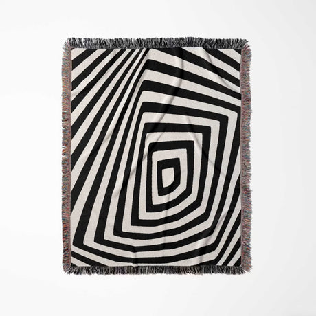 Psychedelic abstract art woven blanket throw tapestry with a geometric pattern full view on a light gray background.