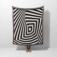 Psychedelic abstract art woven blanket throw tapestry with a person partially visible underneath on a white background.