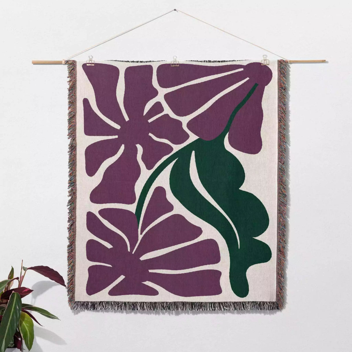 Purple Matisse flowers woven throw blanket as Woven wall art with purple floral design on a white background