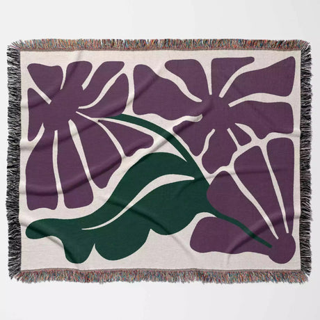 Decorative purple Matisse flowers woven throw blanket with purple floral design on a beige background