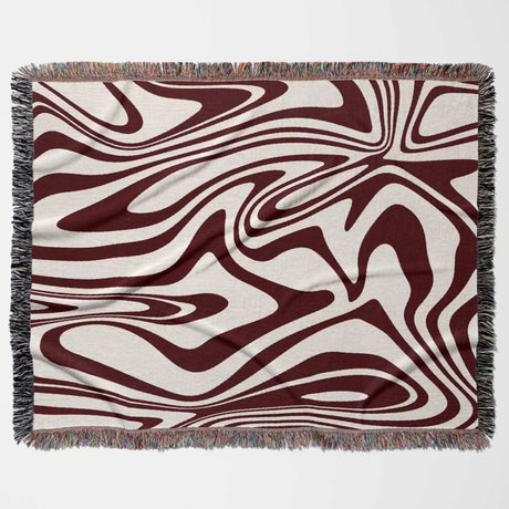 Red marble woven throw blanket for couch with an abstract pattern on a white background