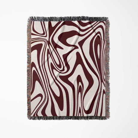Red marble woven throw blanket for couch on a light gray background