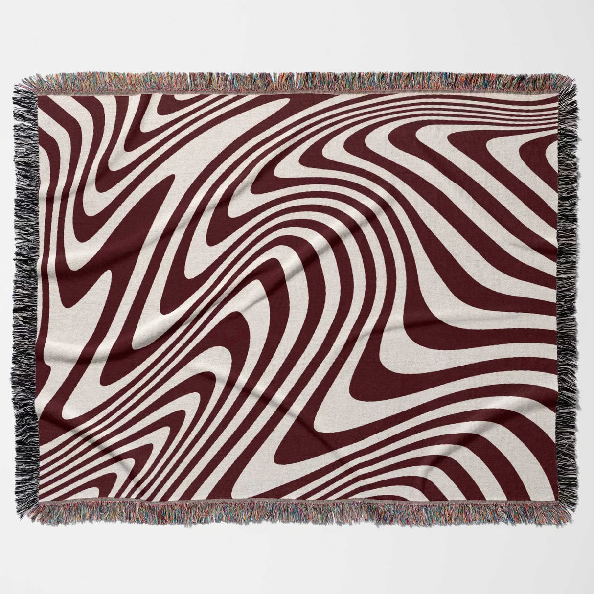 Red modern decorative woven throw blanket with wavy brown and beige pattern on a white background