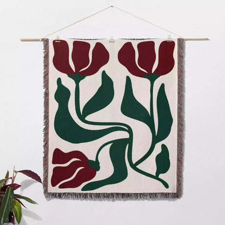 Red and green Matisse flower woven throw blanket woven wall art with red and green tulip design on a white background