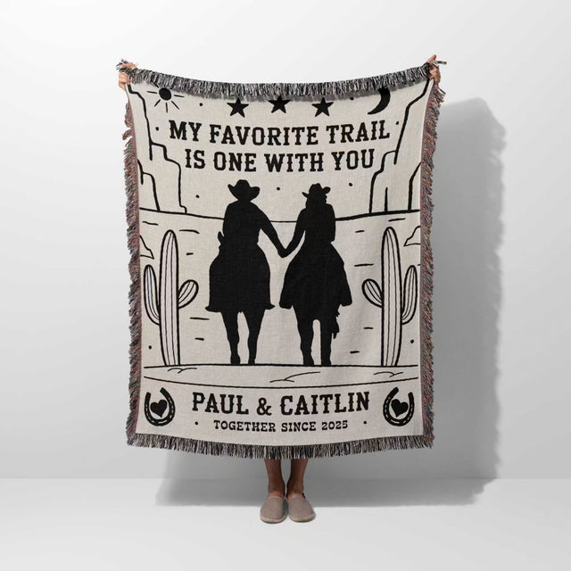 Romantic cowboy and cowgirl cotton anniversary gift – woven throw blanket with cowboy silhouette design and personalized text on a white background