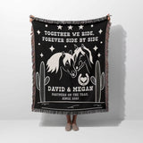 Romantic western 2nd anniversary gift - woven throw blanket with horse design and text held by a person on a white background