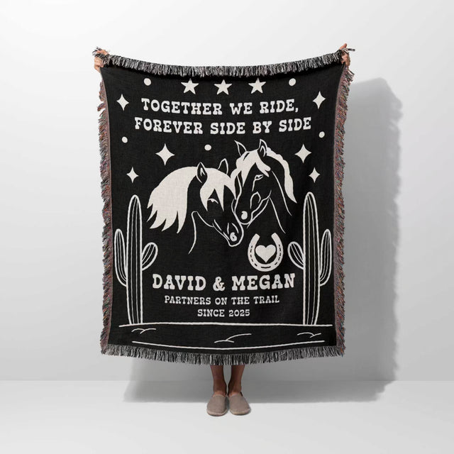 Romantic western 2nd anniversary gift - woven throw blanket with horse design and text held by a person on a white background