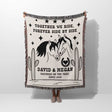 Romantic western cotton anniversary gift - woven throw blanket with horse design and text held by a person on a white background