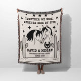 Romantic western cotton anniversary gift - woven throw blanket with horse design and text held by a person on a white background