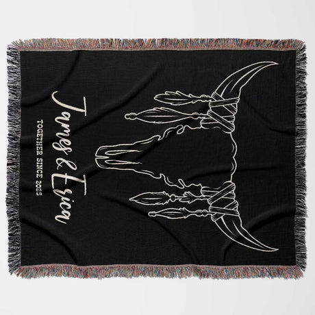 Rustic bull skull 2nd anniversary gift woven throw blanket flat lay on a white background.