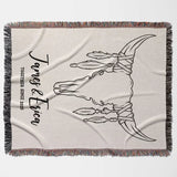 Rustic bull skull cotton anniversary gift woven throw blanket flat lay with decorative design and text on a white background