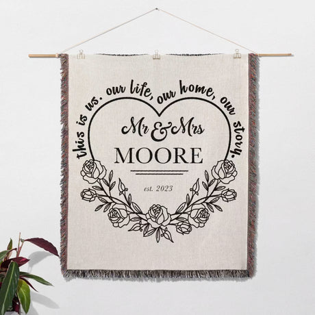 Personalized wall hanging with 'Mr & Mrs Moore' text and floral design on a white background.