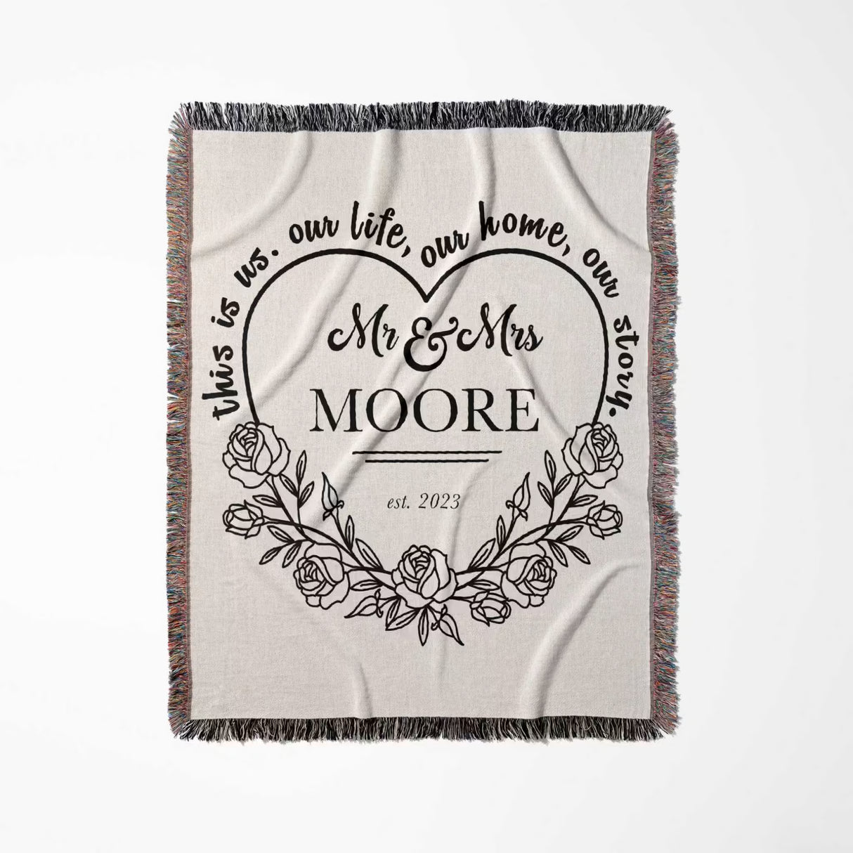 Rustic Mr and Mrs 2nd year anniversary gift woven throw blanket with floral design and text flat lay on a white background