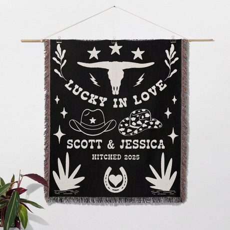 Rustic western 2nd anniversary gift woven throw blanket wall hanging with white text and graphics, including cowboy hats and a longhorn skull, on a white background.
