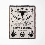 Rustic western cotton anniversary gift woven throw blanket full view with cowboy-themed design and text on a white background