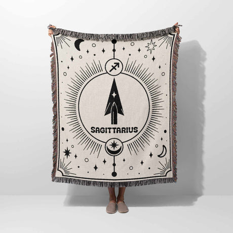 Showcasing the full design, this image features the Sagittarius Zodiac Blanket being held up. The detailed zodiac pattern and vibrant fringes are highlighted, making it a unique birthday gift idea for astrology lovers and home decor enthusiasts alike.