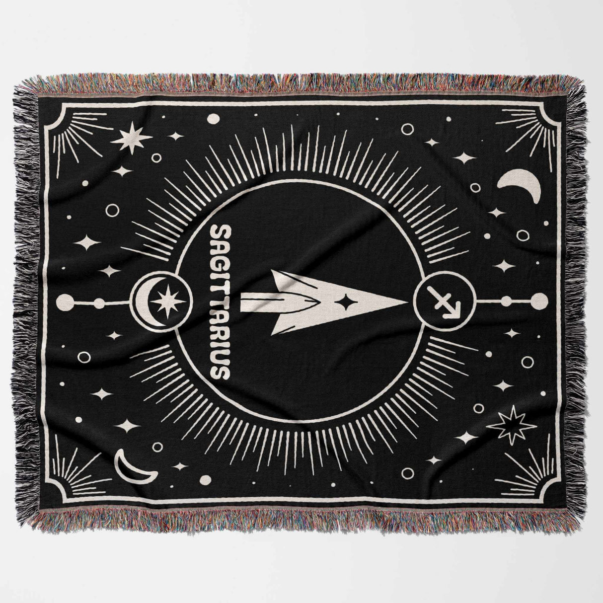 The Sagittarius Zodiac blanket is displayed flat in a horizontal orientation, showcasing the complete design. The black and white woven pattern features a central arrow symbol and surrounding celestial elements.