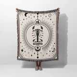 A full view of the Scorpio Zodiac Blanket held vertically, displaying the detailed Scorpio symbol and artistic design. The high-quality woven fabric and multicolor fringe make it a standout piece, perfect for gifting or adding a personalized touch to home decor.