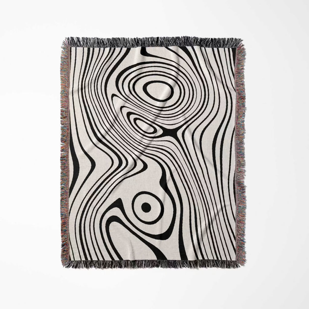 Simple black and white modern couch woven throw blanket with black and white abstract pattern on a white background