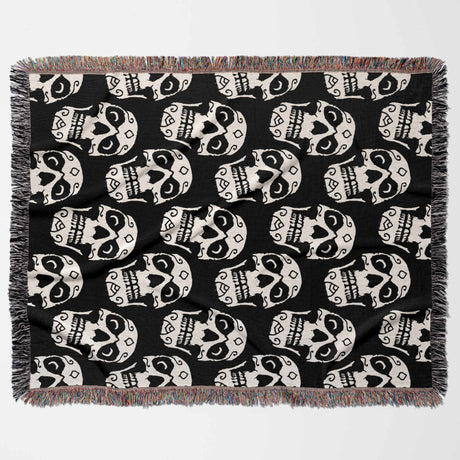 Black blanket with white skull pattern on a white background