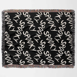 Black blanket with 'Spooky' text pattern on a white background