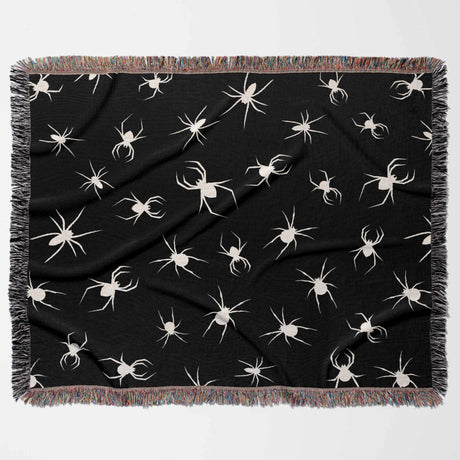 Spooky spiders halloween woven throw blanket full view on a white background.