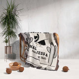 Two horses woven throw blanket cotton anniversary gift with text and graphics draped over a chair in a room with a plant and decorative items.