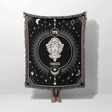 A person holds up the Virgo Zodiac Blanket to display its full design. The image showcases the blanket's size and detailed pattern, making it an ideal gift for anyone who appreciates astrology and cozy home decor.