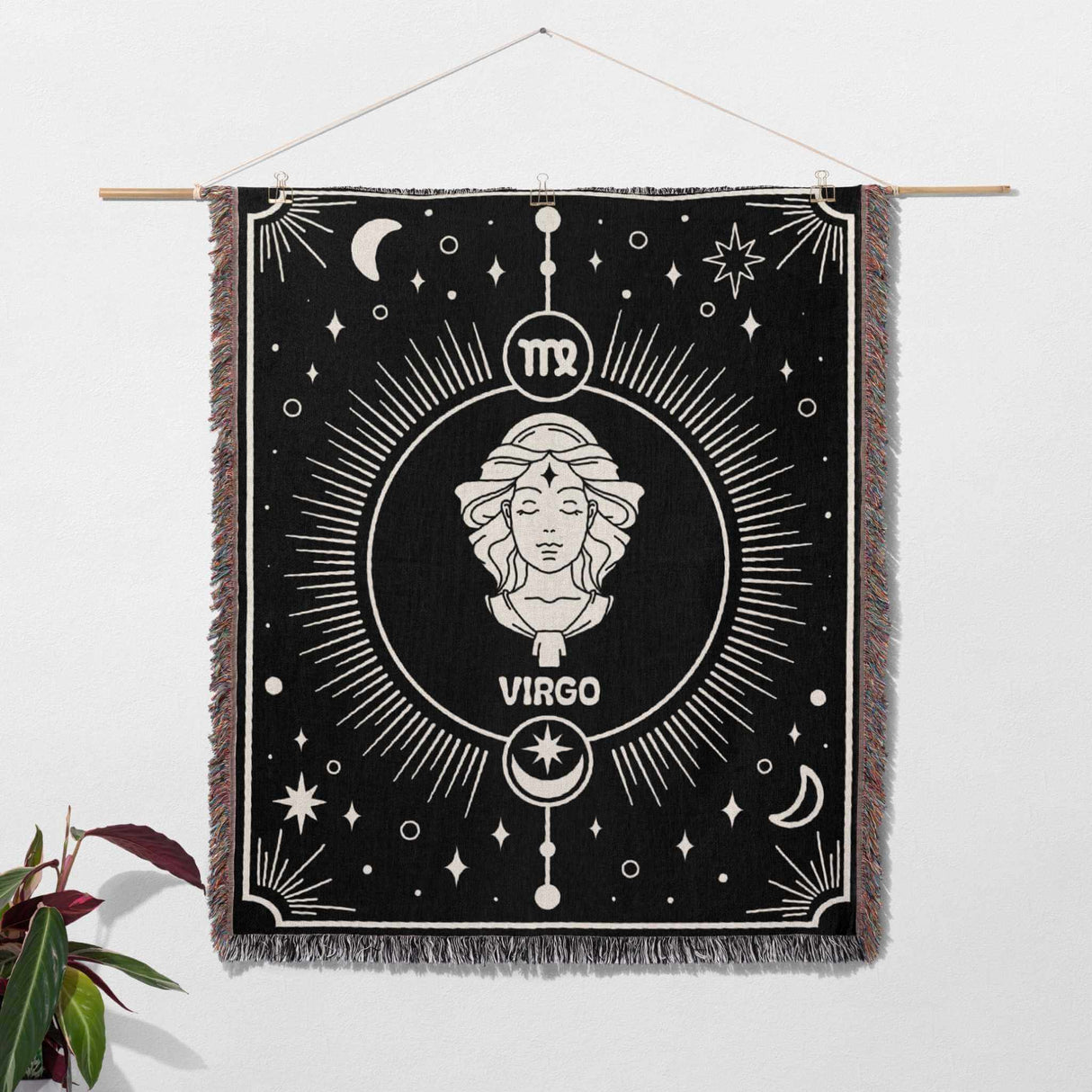 The Virgo Zodiac Blanket is hung on the wall, demonstrating its use as a tapestry. The detailed Virgo symbol and celestial motifs make it a striking piece of wall art that adds character to any room.