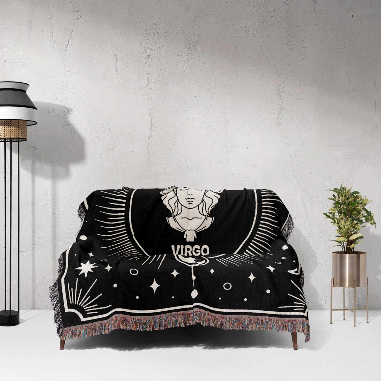 The Virgo Zodiac Blanket is beautifully displayed on a couch, highlighting its use as a stylish sofa throw. The intricate Virgo design and celestial elements enhance the decor of the living space.